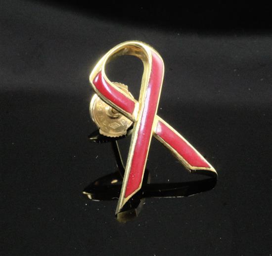 An 18ct gold and red enamel Aids Awareness ribbon brooch, 22mm.